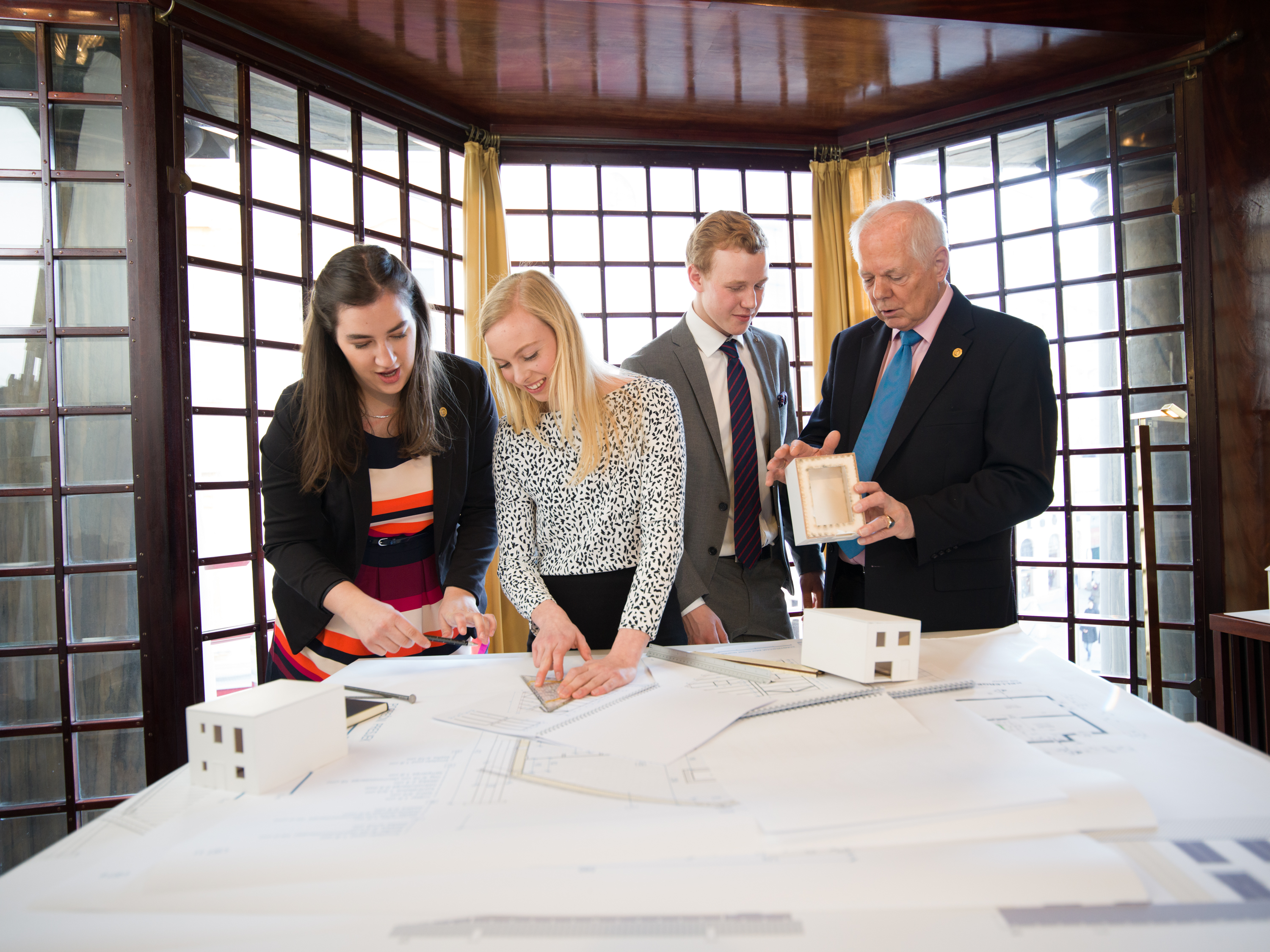 People of Action still photography shoot of Austrian Rotaractors and Rotary members from various clubs in Vienna. The Austrian members pioneered an intergenerational mentoring program called "Intarconnect," which involves support and networking. In addition, the group started an initiative to build homes in their Rotary district, although across borders, in Srebenica, Bosnia. The site of the famous massacre is still recovering from the war.