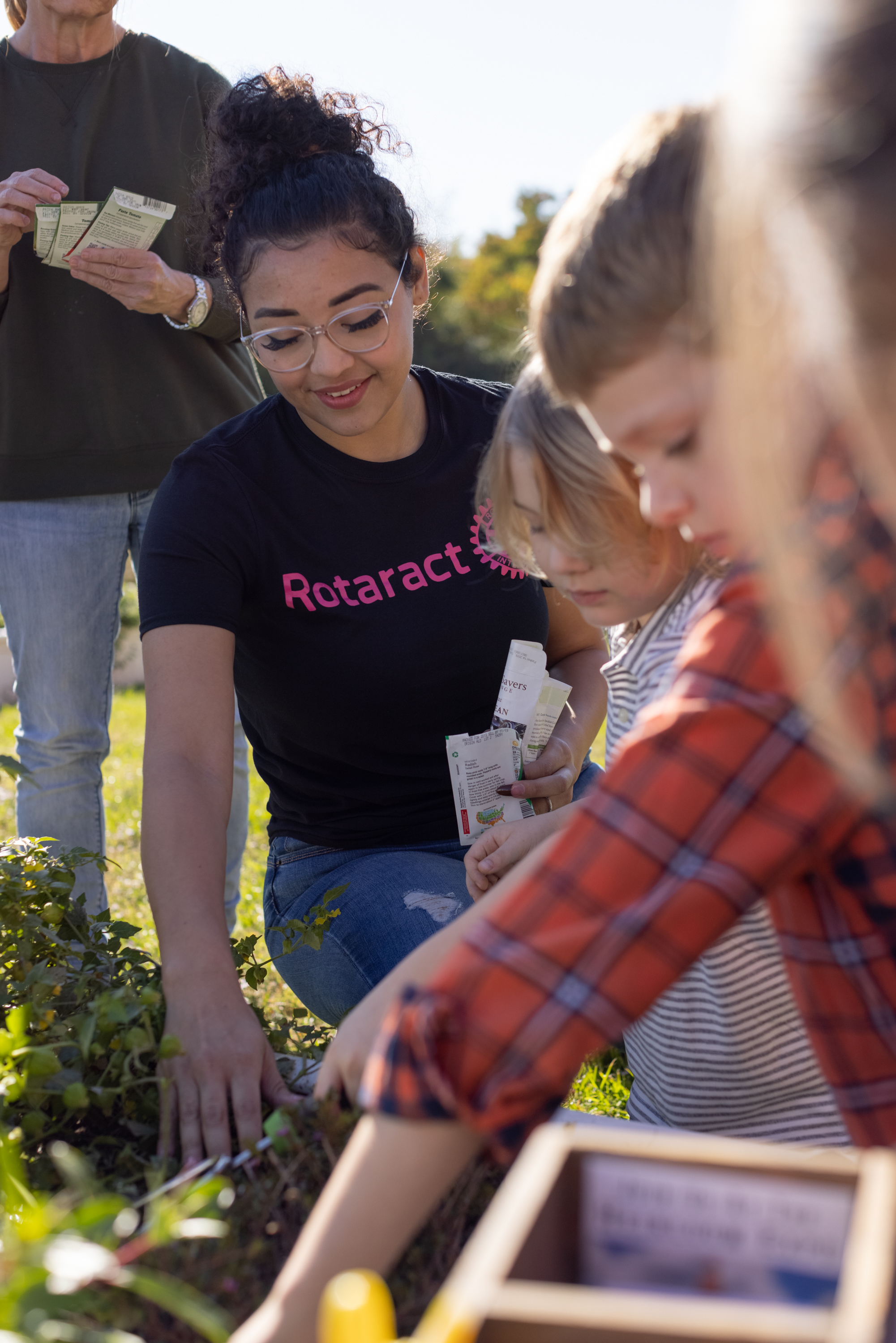 Members of Rotary clubs in the Houston area work in a community garden built by the Rotaract Club of Seabrook at Evelyn Meador Branch Library in Seabrook, Texas, USA. 14 November 2021.
